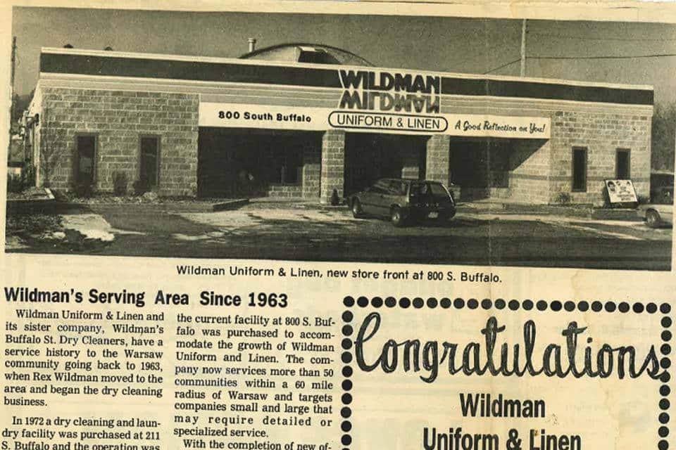 Wildman Uniform & Linen building at 800 S. Buffalo with company sign visible.