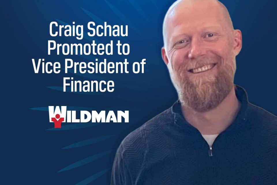 Smiling Craig Schau with beard next to text announcing his promotion to Vice President.